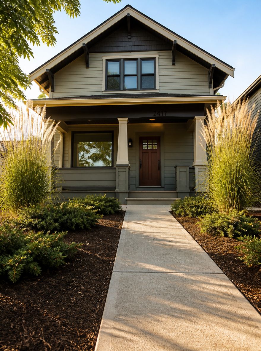 Foundation bed with corner grasses and spreading junipers