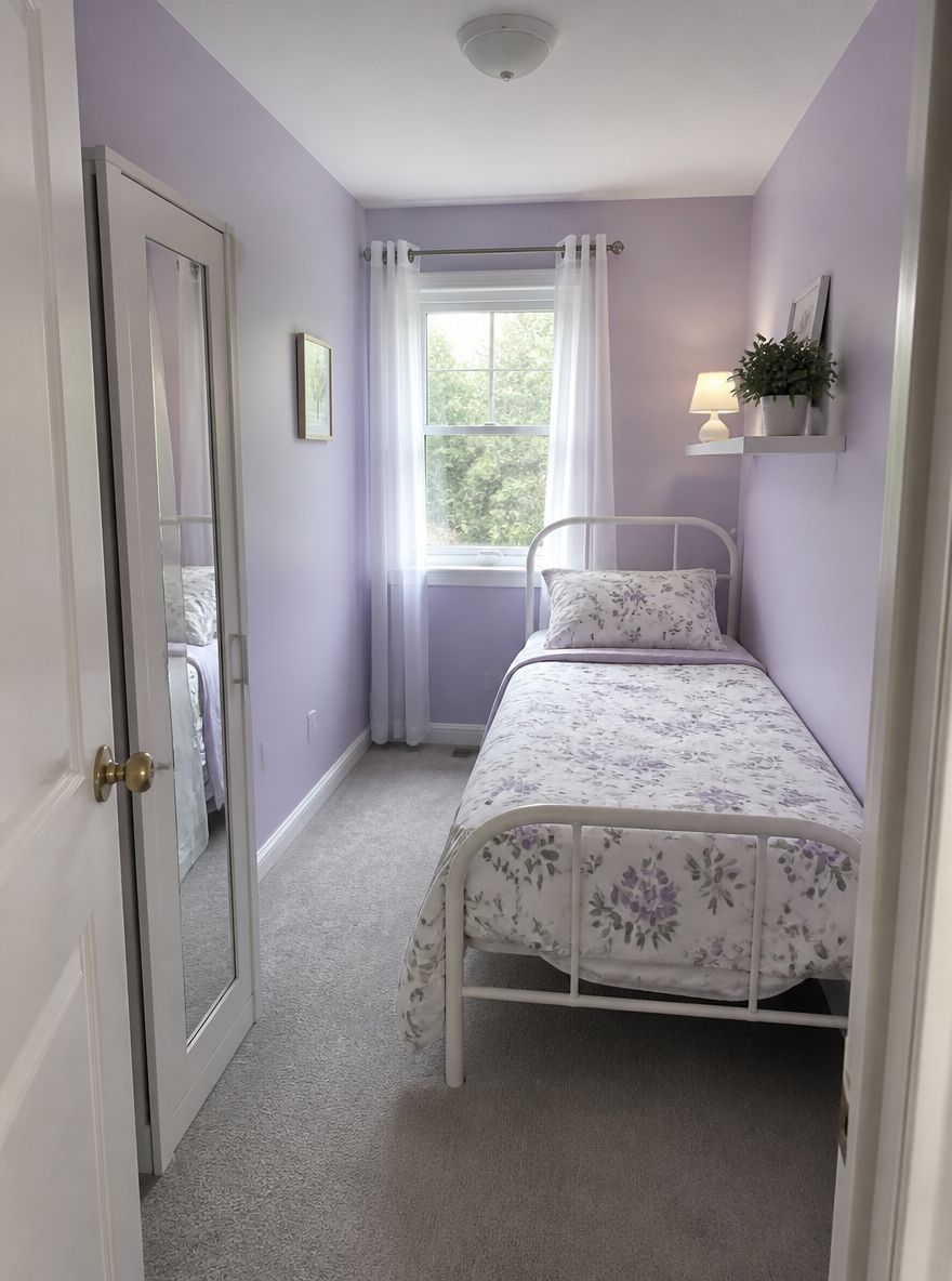Slim mirrored wardrobe in a narrow guest room layout