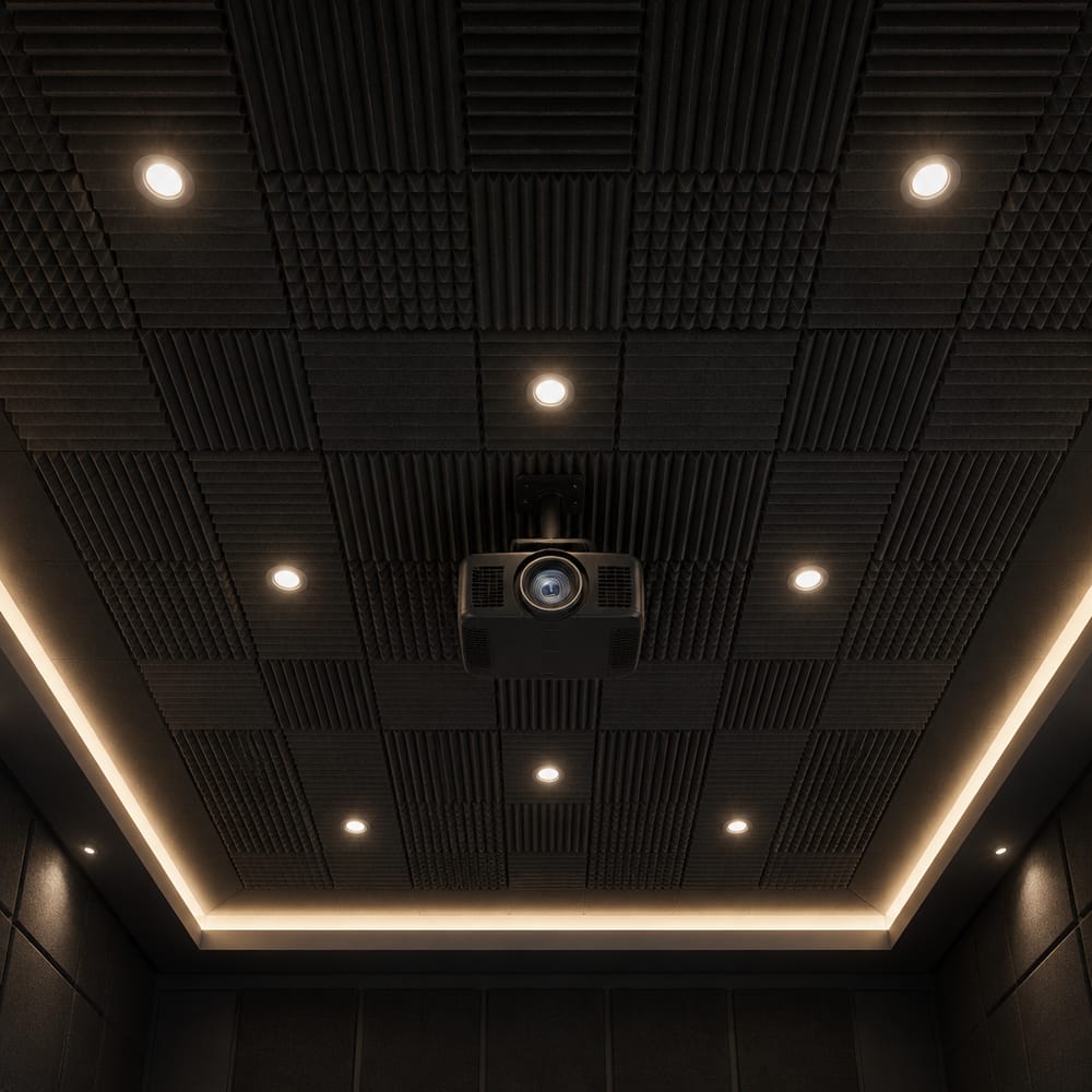 Ceiling-mounted projector among acoustic foam tiles
