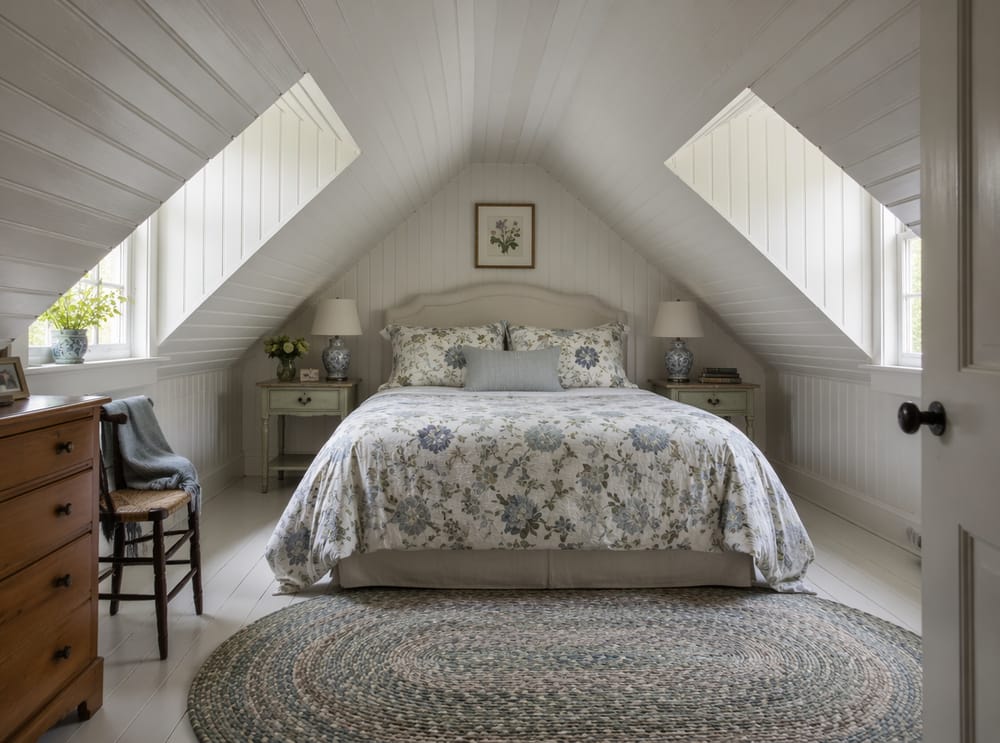 Cottage dormer windows flanking a centered low bed