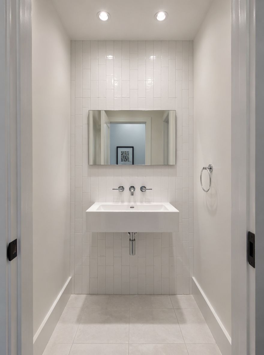 Vertical subway tile stack behind chrome basin