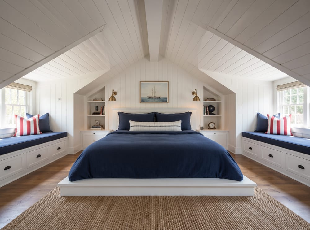Twin dormer window seats flanking a centered platform bed