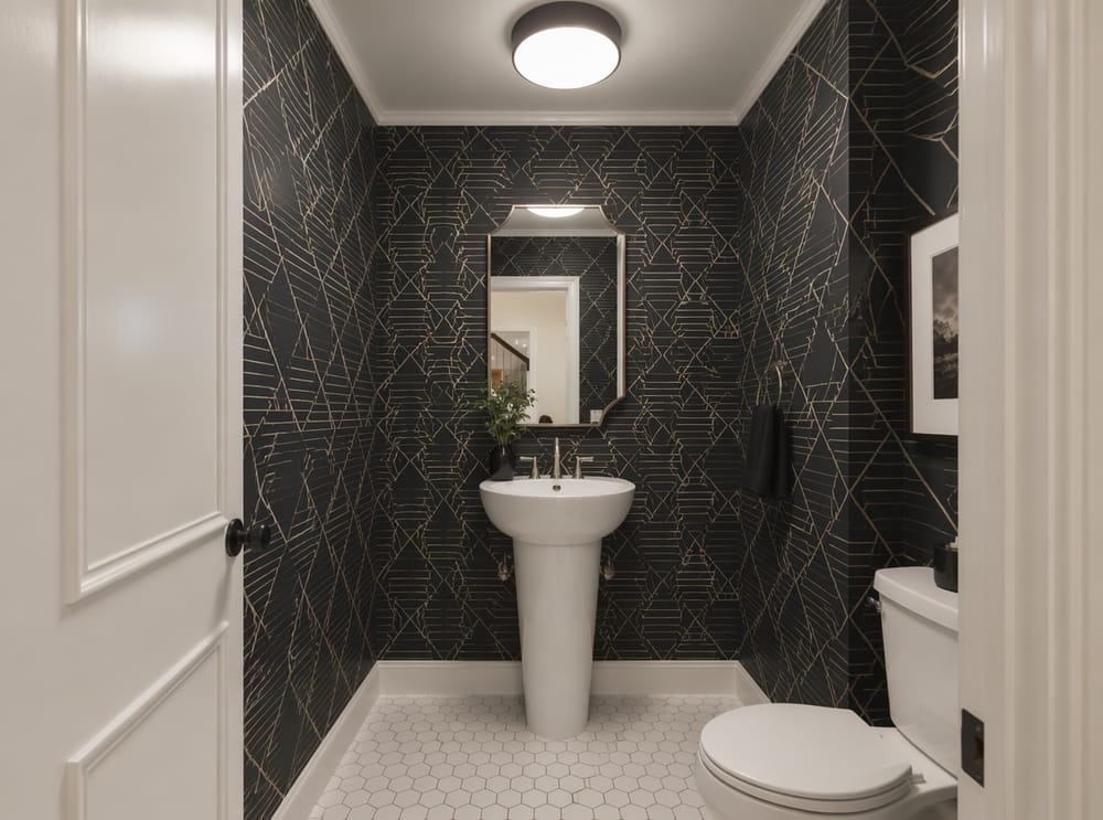 Pedestal basin against bold geometric wallpaper