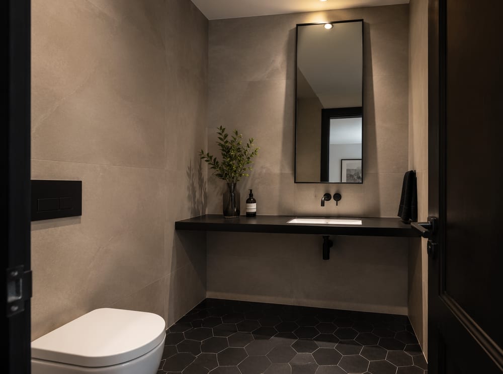 Black steel shelf with full-height leaning mirror